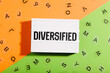 Diversified word written in letters on a lightbox on duocolor