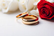Intimate wedding rings with a single red and white rose, symbolizing pure and passionate love respectively