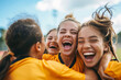 Young female soccer players in a joyful group hug after a victorious game