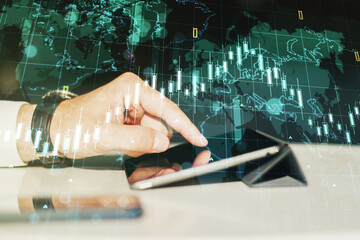 Poster - Multi exposure of abstract creative financial chart with world map and with finger presses on a digital tablet on background, research and analytics concept