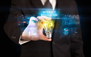 Poster - Businessman holding a light bulb, online security concept