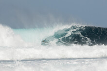 Surfer Conquering A Magnificent Ocean Wave