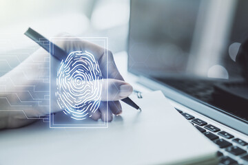 Aufkleber - Abstract creative fingerprint concept with hand writing in notebook on background with laptop. Multiexposure