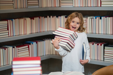Poster - Little student read book. Child at school. Schoolboy reading book in library. Kids development. Pupil learn to read. Child from elementary school read books in a book store.