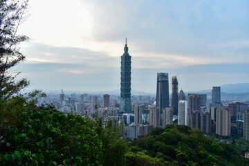 Wall Mural - Aerial view of skyline of Taipei city with Taipei 101 Skyscraper at sunset from Xiangshan Elephant Mountain. Beautiful landscape and cityscape of Taipei downtown buildings and architecture in the city