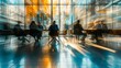 © korisbo - A blurred background of business people in a office meeting room, sitting around the table and discussing ideas. The focus is on their silhouettes against the glass wall behind them
