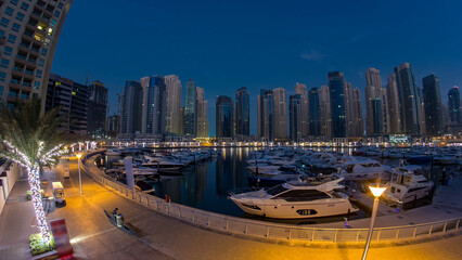Wall Mural - Dubai Marina at Blue hour night to day timelapse with yachts