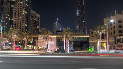 Wall Mural - Street view of Dubai skyline timelapse and rush hour traffic in downtown at night