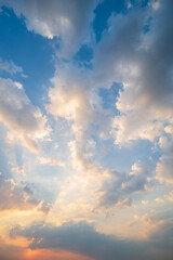 Wall Mural - sunset or sun rise sky with rays of  light shining clouds and sky background and texture