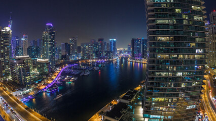 Wall Mural - Water canal on Dubai Marina skyline at night timelapse.