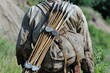 hunter with stonetipped arrows in a quiver on back