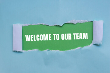 Welcome to our team words written on blue torn paper with green background. Conceptual business symbol. Copy space.