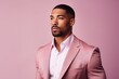 Waist up portrait of handsome african american man in pink suit