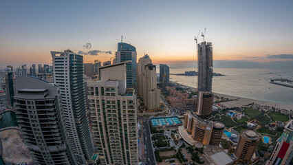 Wall Mural - JBR and Dubai marina after sunset aerial day to night timelapse