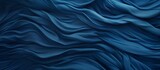Fototapeta Las - A close up of a fluid, electric blue silk cloth with a mesmerizing wind wave pattern, resembling the fluidity and movement of water