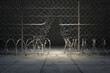 Dramatic Spotlight Illuminates a Damaged Chain Link Fence at Night