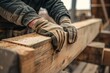 Close-up of hands working with wood in a workshop. Detail and craftsmanship. Raw timber and gloves. Careful manual labor. Generative AI