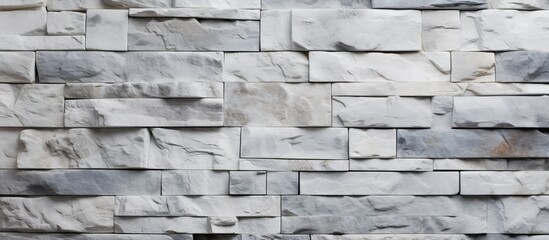 Poster - A detailed closeup of a rectangular grey brick wall, showcasing the intricate brickwork pattern. The monochrome photography highlights the beauty of this composite material, resembling a stone wall