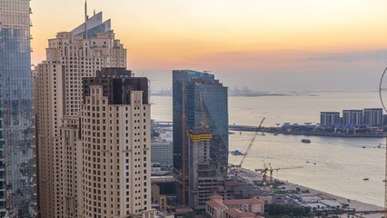 Wall Mural - JBR and Dubai marina after sunset aerial day to night timelapse