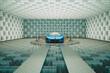 Sleek Blue Sports Car Undergoing Precision Acoustic Testing in Advanced Facility