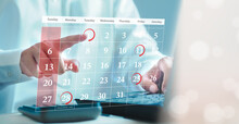 Businessman schedules meeting planning and marks red circle to Laptop reminders with scheduled appointments on the calendar. Schedule an activity
