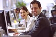 © venusvi - Happy Employees: Employees happily working in a beautifully decorated office. Shows good corporate culture
