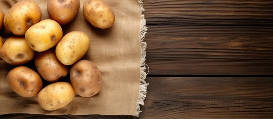 Wall Mural - A close up of a cluster of potatoes on a wooden surface