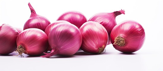 Wall Mural - Group of red onions on a white surface