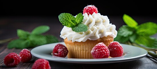 Sticker - A cupcake with raspberry and cream on a plate