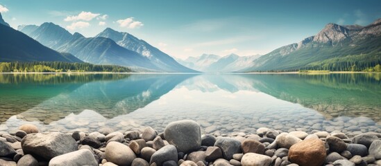 Sticker - Serene lake surrounded by mountains and rocks