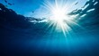 sun shining light in blue clearly deep water sunbeams illuminate the blue underwater sea scene background