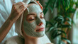  A girl at a high-end beauty salon getting a soothing facial; the esthetician uses nutritious masks and serums to brighten and revitalise her skin, making it gleam with life.