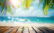 Sunny tropical beach with a wooden table top and palm leaves on a bokeh sunlight background