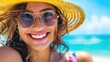 Smiling young attractive woman portrait wering sun glasses and hat on the beach