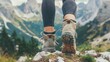 close up of feets from a woman / female person with hiking / hiker shoes, in the background blurry mountains, concept: Hiking / wilderness lovers, copy and text space, 16:9