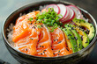 Bowl with salmon, avocado and other ingredients. Healthy food.