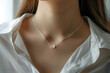 elegant silver necklace with small butterfly pendants on woman neck