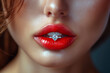 gold jeweled diamond ring in a woman lips painted a red lipstick close up