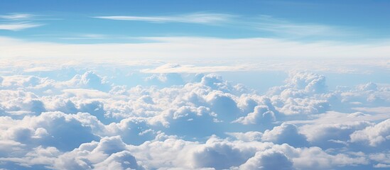 Wall Mural - Numerous clouds are scattered in the sky, positioned high above the earth's surface