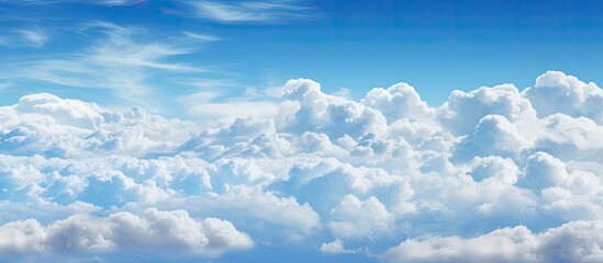 Wall Mural - there is a plane flying through the clouds in the sky