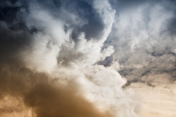 Sticker - A large cumulonimbus rain cloud close-up in the evening light, a large cloud in the light of the evening sun close-up