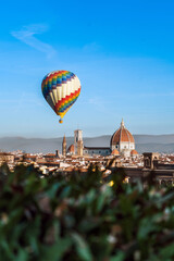 Wall Mural - A large hot air balloon over the center of Florence. View of the renaissance capital from Piazza Michelangelo. Santa Maria del Fiore.