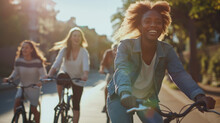 A Dynamic Shot Of Diverse Friends Cycling Together Down A City Bike Path, Their Movement And Laughter Encapsulated In The Soft Light Of Late Afternoon, Creating A Sense Of Motion A