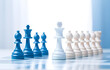 © Oleksiy - colorful white and blue chess on chessboard on white wooden tabl