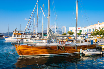 Wall Mural - Wooden sailing yacht boat in Adamas port, Milos island, Cyclades, Greece