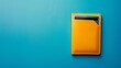 Top view of a credit card in a yellow wallet on a blue background