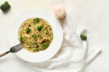 Sticker - Plate of tasty pasta with broccoli on white background