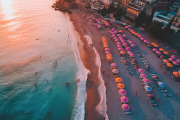 Wall Mural - Aerial view of sandy beach with colorful umbrellas, swimming people in sea bay with transparent blue water in summer. Top view. Sunset