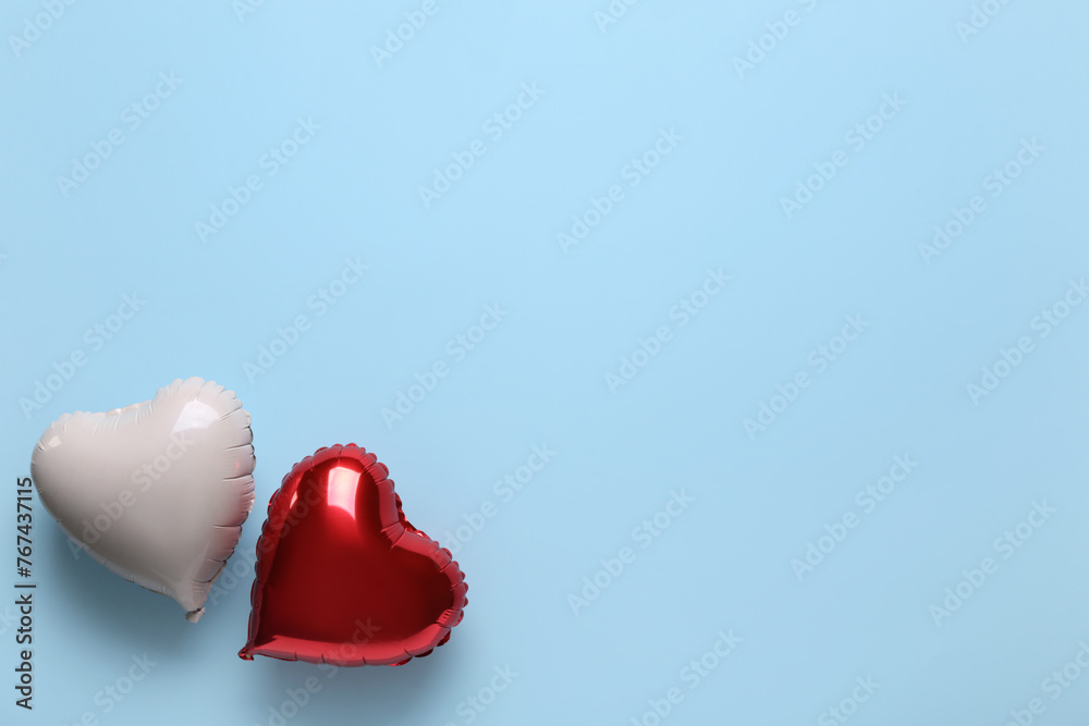 Heart shaped air balloons on blue background. Valentine's Day celebration