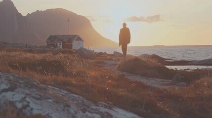 Sticker -  a man standing on top of a hill next to a body of water with a house on top of it.